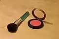 Contemporary blush compact and applicator brush