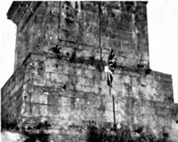 The base of the Obelisk in July 1913, with a Union Jack planted on it by loyalist militants