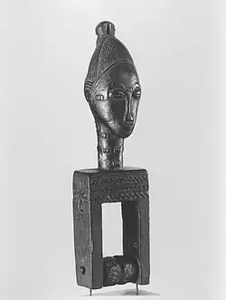 Heddle pulley with female head; late 19th or early 20th century; wood; 20.6 × 5.4 × 4.8 cm (81⁄8 × 21⁄8 × 17⁄8 in); Brooklyn Museum