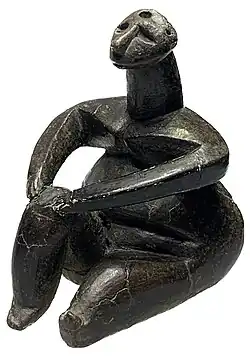 The Sitting Woman, by the Hamangia culture, c. 5000 BC, terracotta, National Museum of Romanian History[8]