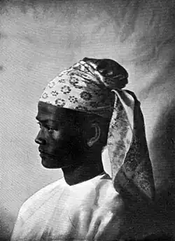 Portrait of a Burmese man in Gaung Baung in early 1900s.