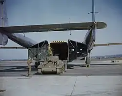 M22 Locust light tank being loaded into C-82