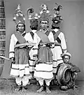 Tandako dancers and a musician in Pasere Maloku, Sulawesi.