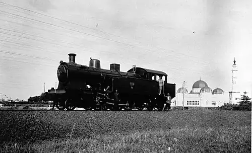 Locomotive with mosque in the background