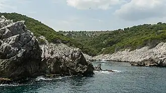 Cala Pedrosa, a cove at the foot of Alt de la Pedrosa plateau.