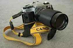 Canon AE-1 Program with telephoto lens and power winder