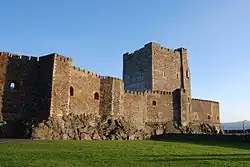 Carrickfergus Castle is a 12th-century Norman castle in on the shore of Belfast Lough. Besieged by Scots, Irish, English and French, the castle has long played an important military role in the history of Ireland.
