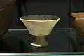 Marble vessel, with very thin walls and a short stem.