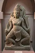 Cham carved sandstone sculpture of Shiva carrying a trishula in Southeast Asia.