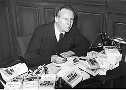 Charles Plisnier signing copies of Faux passeports after receiving the Prix Goncourt, 1937