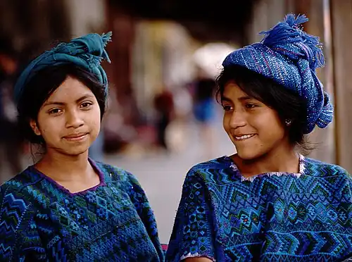 Mayan girls in Chichicastenango, their clothing indicates they are from Santa Catarina Palopó