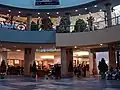 The centre court and food court of Chinook Centre before renovations from the lower level on July 23, 2006, showing Club Monaco, Yogen Fruz, and an HMV (closed) poster.