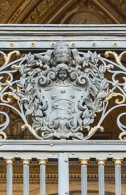 Baroque cartouche at the entrance of St. Peter's Basilica, Rome, unknown architect or blacksmith, c.1615