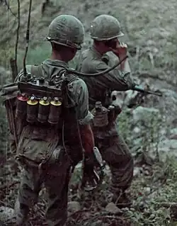 U.S. Army radio operator with multiple M18 grenades (Vietnam 1966)