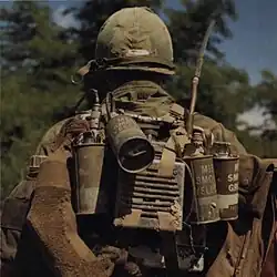 U.S. Army radio operator with M18 grenades (Vietnam 1968)