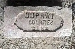 Brick embossed with the writing "Dupart Courties Gers"