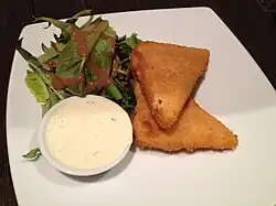 Image 75Fried cheese, served with tartar sauce and side salad (from Czech cuisine)