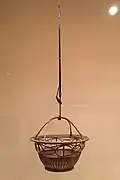 Ryūrikyō hanging flower basket. Smoked dwarf bamboo and rattan. By Tanabe Chikuunsai I, late Meiji–early Taishō period, c. 1900–1920
