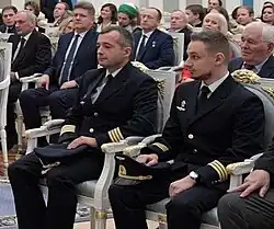 Damir Yusupov and Georgy Murzin sitting in chairs in the Kremlin