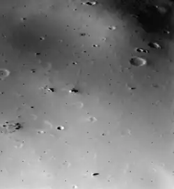 The surface of Deimos, a moon of Mars, is covered by a layer of regolith estimated to be 50 m (160 ft) thick. Viking 2 orbiter image is from a height of 30 km (19 mi).