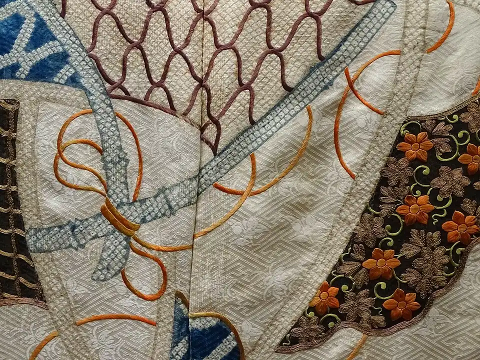 Rinzu satin, dyed and heavily embroidered