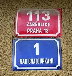 A typical Prague combination: red conscription number above, blue orientation number below