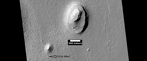 Buttes, as seen by HiRISE under HiWish program. Buttes have layered rocks with a hard resistant cap rock on the top which protects the underlying rocks from erosion.