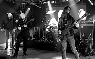 The band live at ProgPower Europe 2023. From left to right: Frank Sacramone, Jamie van Dyck and Ryan Griffin; Ben Shanbrom is behind Griffin.