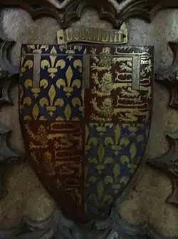 Shield with coat of arms showing fleur-de-lis and leopards