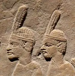 Nubian prisoners. They wear the typical one-feathered headgear of Taharqa's soldiers.[55]