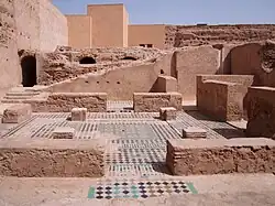 An annex area on the south side of the palace, probably including the remains of a bathhouse (hammam)