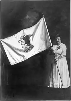 Ella Park Lawrence holds the original Illinois state flag,  1915.