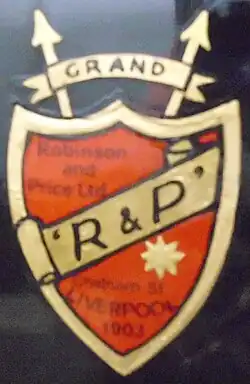 Robinson & Price logo, a red shield with a gold stripe across it containing the writing "R & P"