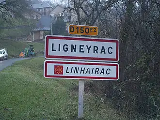 A bilingual road sign, entering Ligneyrac