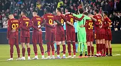 11 footballers standing together