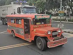 A jeepney with a side door in Quezon City