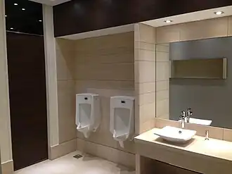 Typical common men's bathroom on all levels at the Fakhro Tower