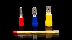 The image shows three Faston style male terminals in three different sizes. They all have insulation in different colours.