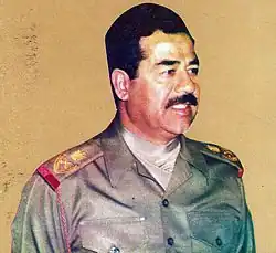 President Saddam Hussein of Iraq wearing an olive green cravat as a part of his Iraqi Army field marshal's uniform