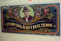 Fileteado-style portrait of Carlos Gardel located opposite the ticket counter