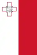 The rudder or fin flash used by Maltese military aircraft consists of two equal vertical strips, one white and the other red with the white leading and bearing across its top third a George Cross proper fimbriated in red.