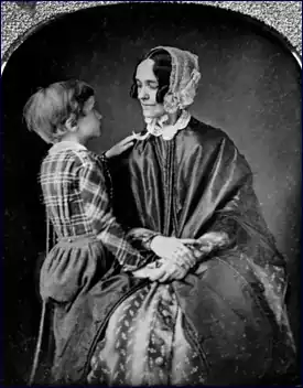 Jane Pierce holds her son Benjamin on her lap