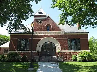 Flint Public Library (1891–92), Middleton, Massachusetts. MacDonald designed the stained glass windows at left & right.