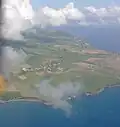 Flying towards the north end of the island, looking down part of the west or Caribbean coast