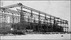 sits within the skeleton of a gantry crane