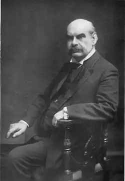 portrait of bald, moustached man in middle age