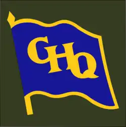 A waving blue flag with a yellow border, and the letters "GHQ" in yellow