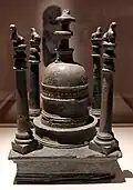 A model resembling the Saidu Sharif stupa, with square base and four columns.[1]