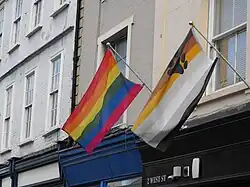 The bear flag flown next to the rainbow flag as an expression of bear and gay pride