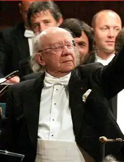 bald man in formal evening costume